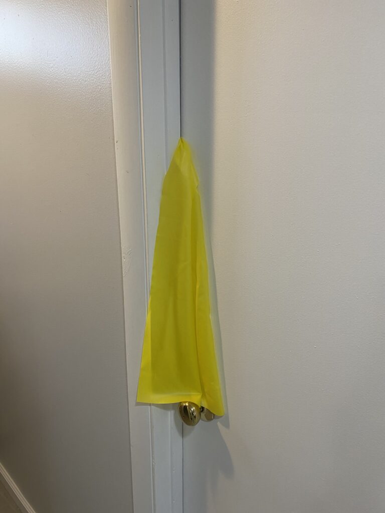 knotted theraband secured in a door